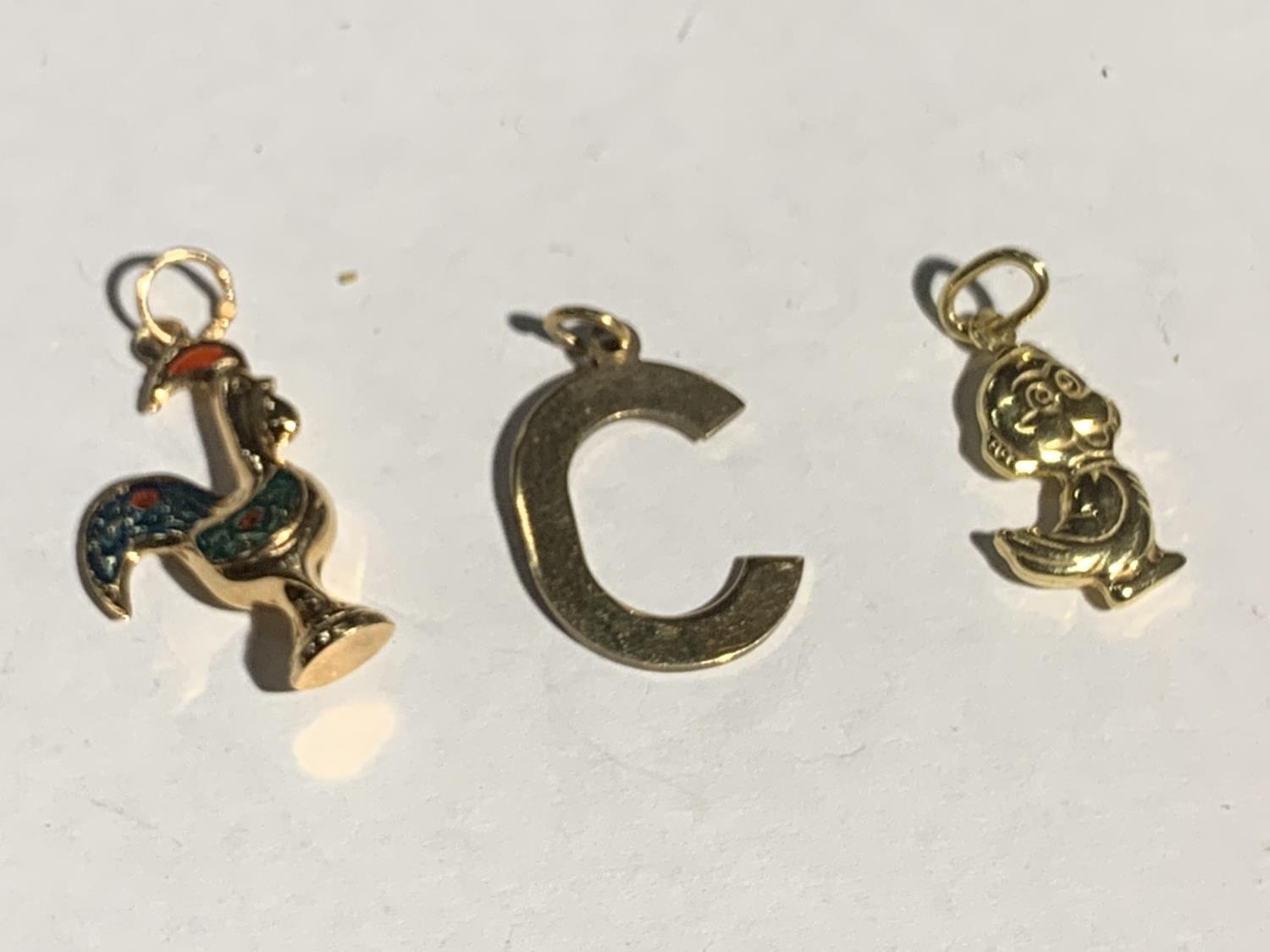 THREE 9 CARAT GOLD CHARMS TO INCLUDE A C, COCKEREL AND A DUCK GROSS WEIGHT 3.7 GRAMS