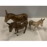 THREE BESWICK DONKEYS, ONE BEING A FOAL