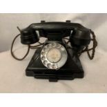 A VINTAGE BLACK BAKELITE TELEPHONE WITH NUMBER STORAGE DRAWER