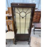 AN EARLY 20TH CENTURY MAHOGANY DISPLAY CABINET ON CABRIOLE SUPPORTS WITH GLAZED PANEL DOOR AND LOWER