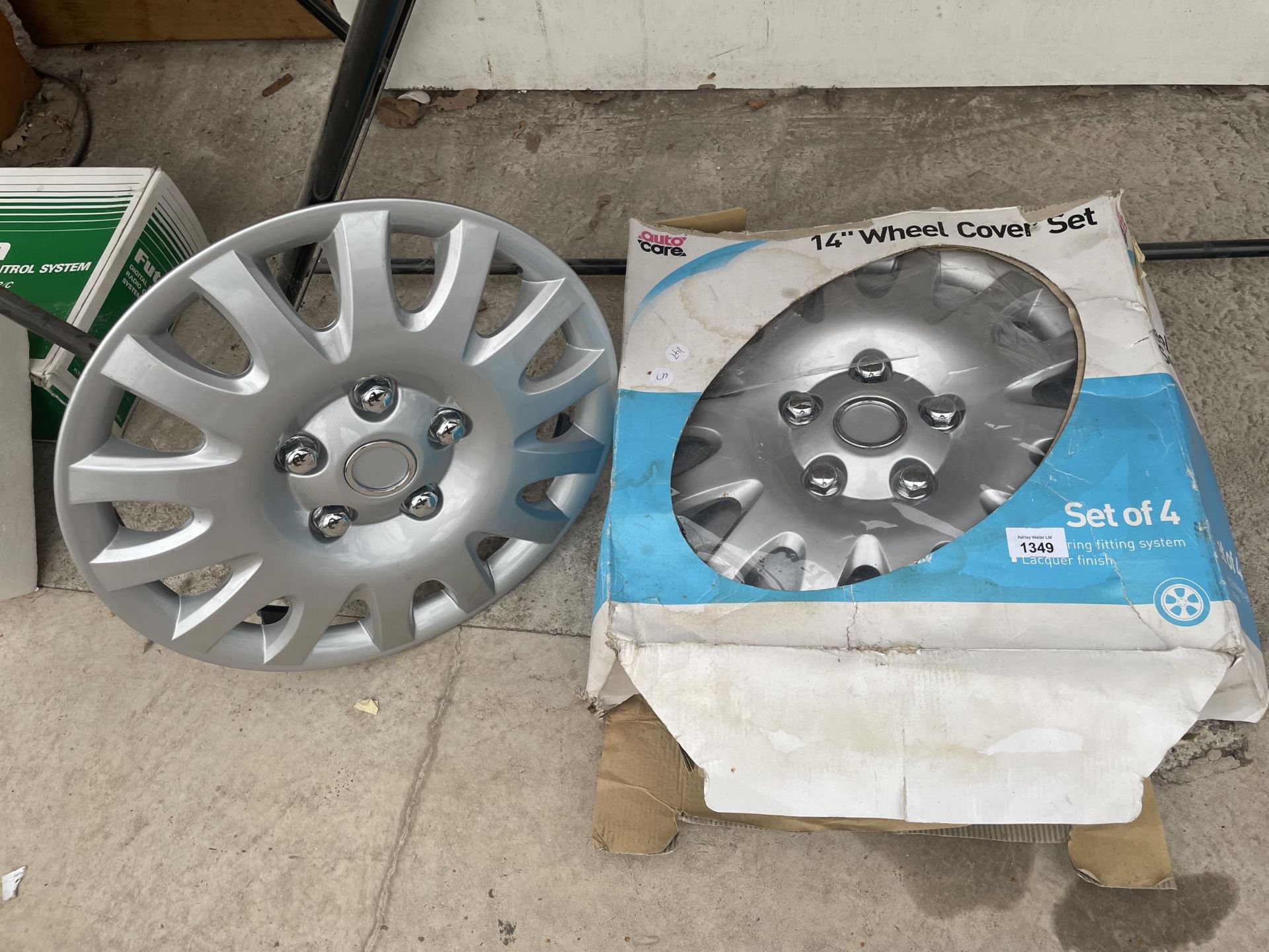 A SET OF FOUR 14" WHEEL COVERS