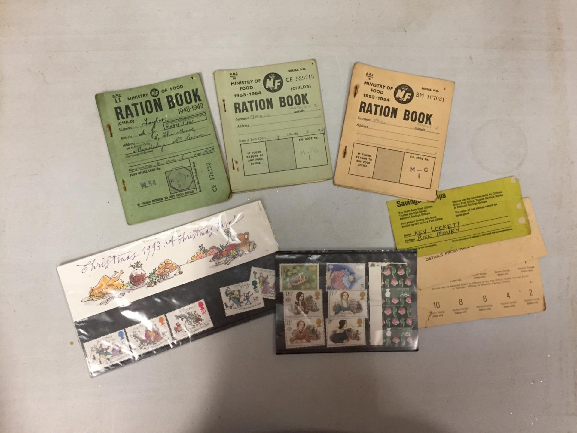 VARIOUS UN-CIRCULATED STAMPS, THREE RATION BOOKS ETC