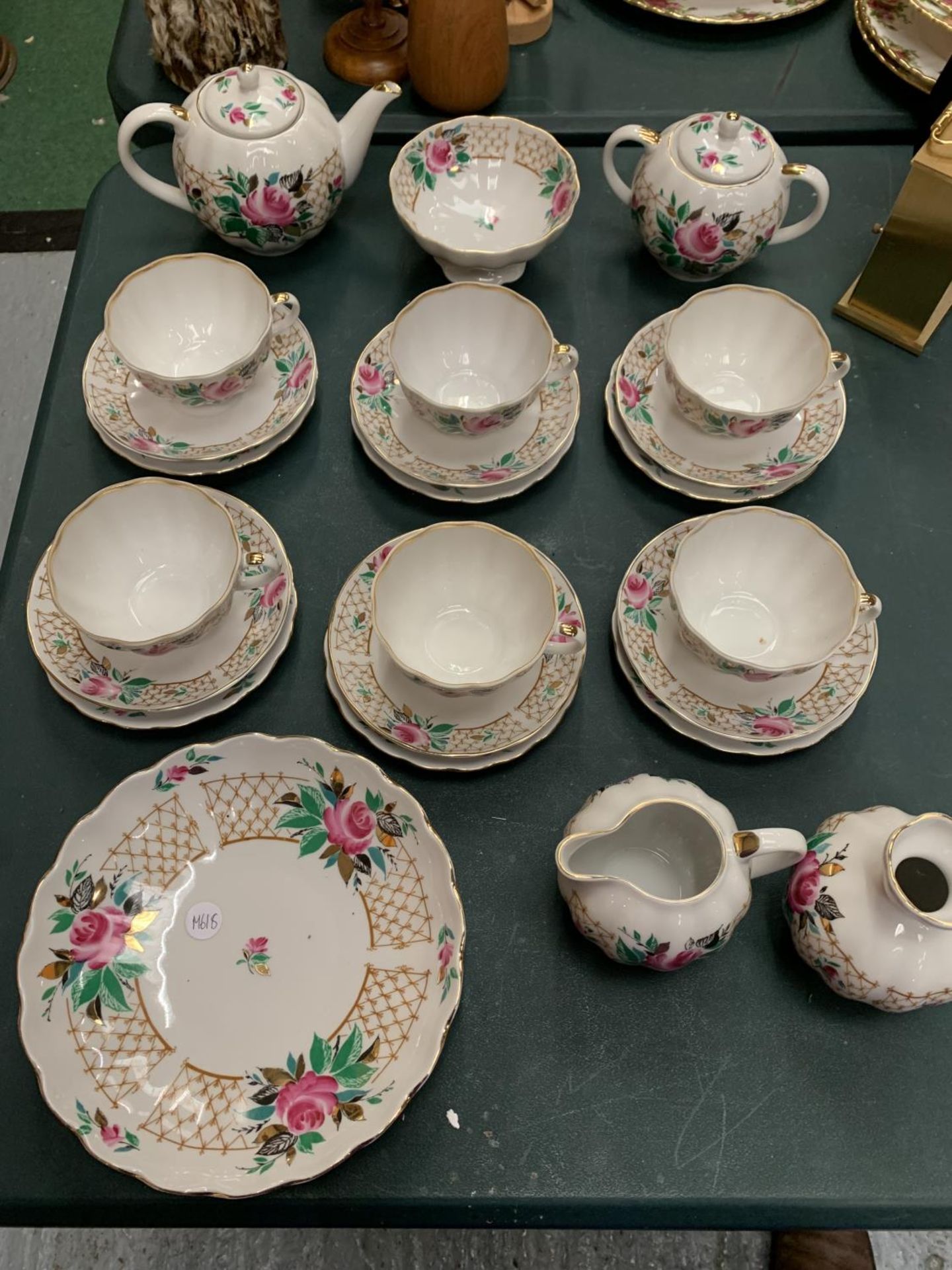 A TEASET TO INCLUDE CUPS, SAUCERS, TEAPOT, SUGAR BOWL, MILK JUG ETC