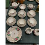 A TEASET TO INCLUDE CUPS, SAUCERS, TEAPOT, SUGAR BOWL, MILK JUG ETC