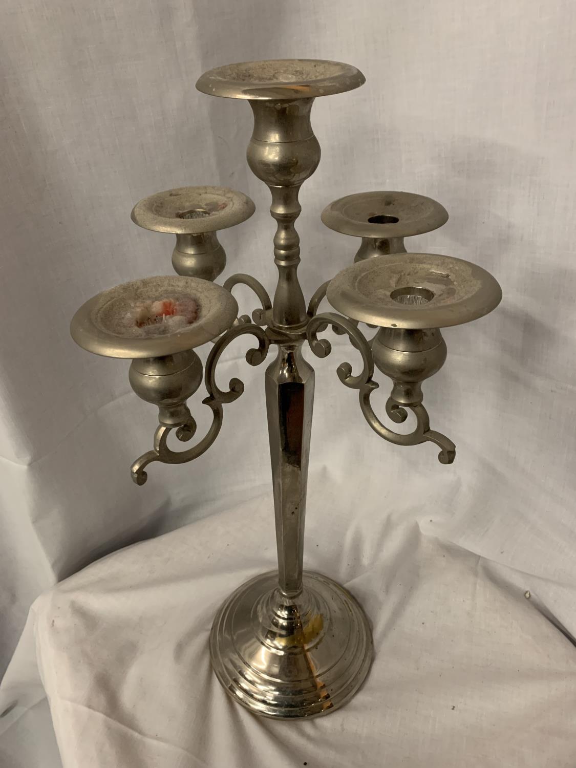 A TALL ORNATE CHROME FIVE BRANCH CANDLEABRA