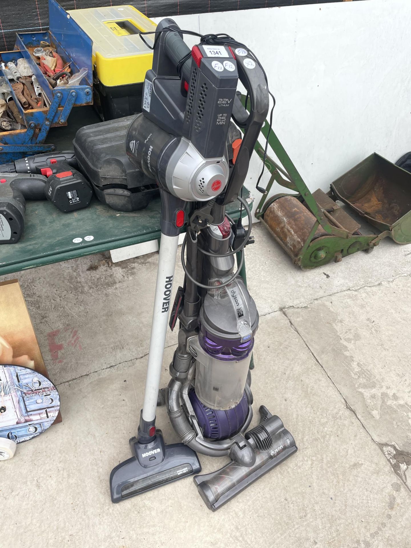 A DYSON DC25 VACUUM CLEANER AND A FURTHER HOOVER HAND HELD VACUUM