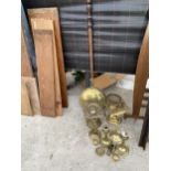 AN ASSORTMENT OF BRASS WARE TO INCLUDE CANDLESTICKS, TRIVET STANDS AND A BED WARMER ETC