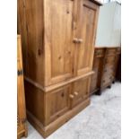 A MODERN PINE TWO DOOR TV CABINET 29" WIDE