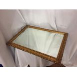 A GILT FRAMED MIRROR SIZE 27 INCHES X 19 INCHES