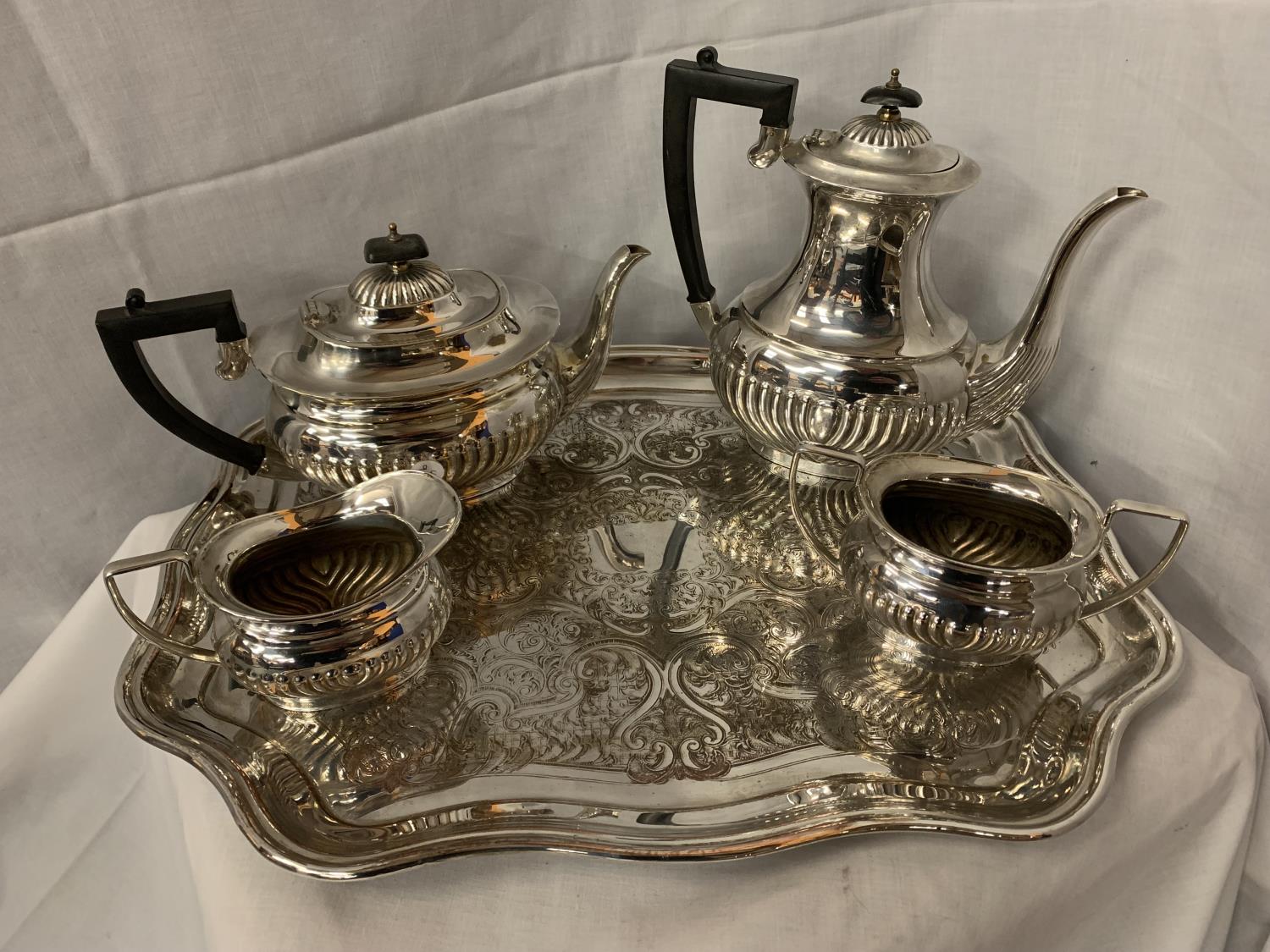 A SILVER PLATED TEAPOT, COFFEE POT, MILK JUG AND SUGAR BOWL ON A TRAY