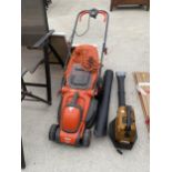 AN ELECTRIC FLYMO LAWN MOWER AND A PETROL LEAF BLOWER