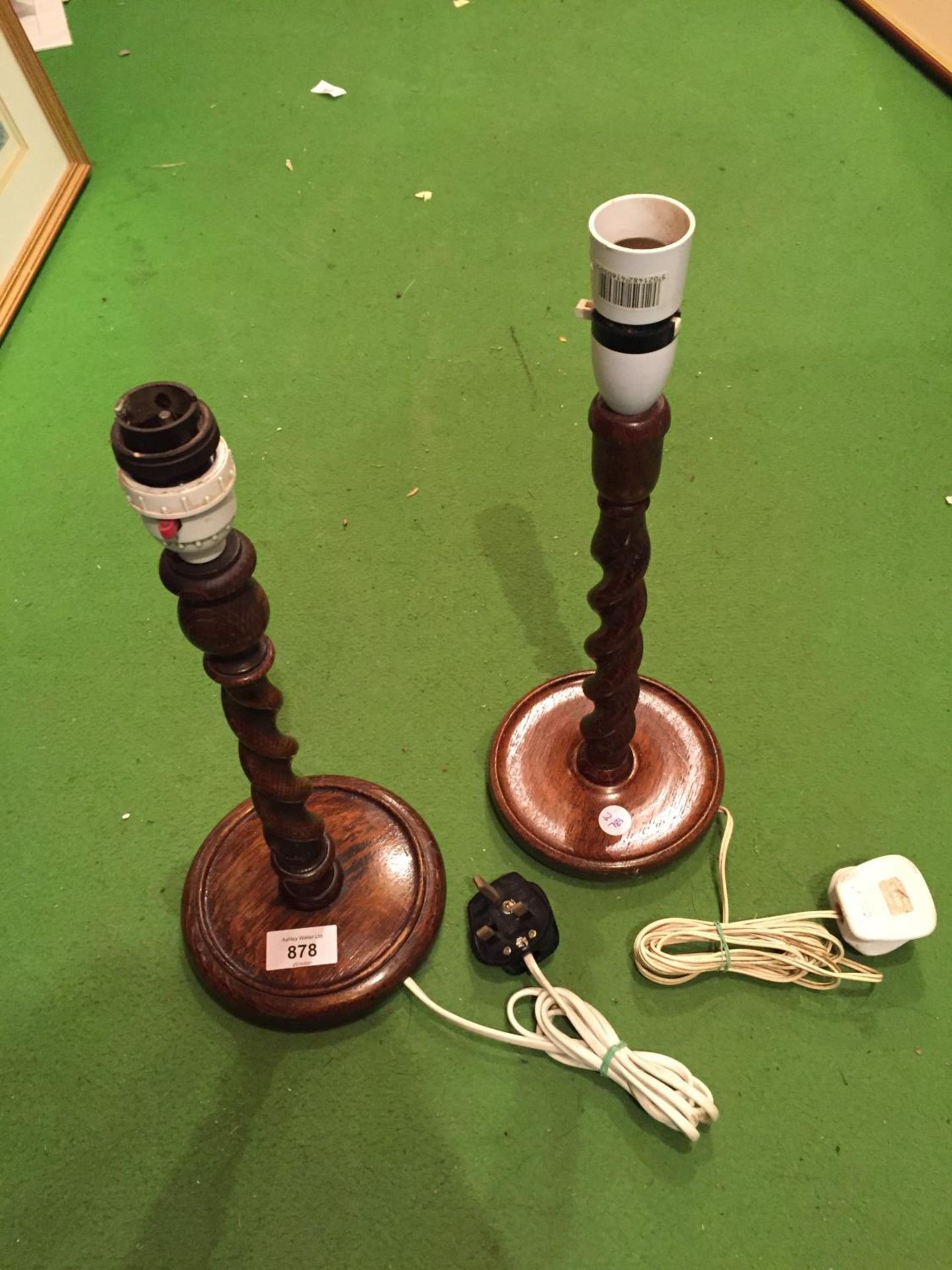 A PAIR OF WOODEN LAMPS WITH A BARLEY TWIST STEM