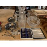 A QUANTITY OF GLASSWARE TO INCLUDE BOWLS, VASE, DECANTERS AND SILVER PLATE