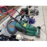 AN ELECTRIC QUALCAST POWER-TRAK 400 LAWN MOWER WITH GRASS BOX IN WORKING ORDER BUT NO WARRANTY GIVEN