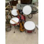 A SMALL CHILDS DRUM KIT AND A CHILDS GUITAR