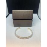 A GUCCI BLIND FOR LOVE BANGLE WITH A PRESENTATION BOX