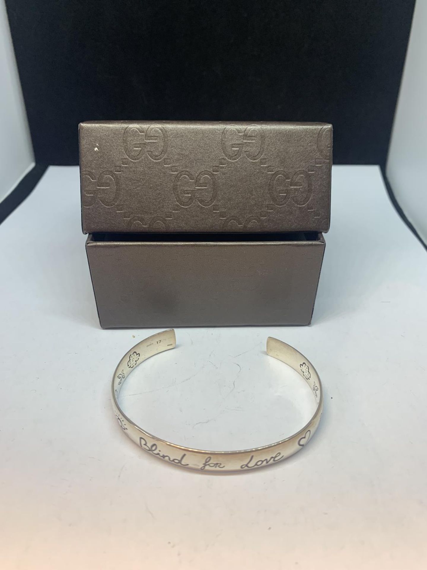 A GUCCI BLIND FOR LOVE BANGLE WITH A PRESENTATION BOX