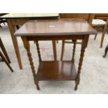 AN EARLY 20TH CENTURY OAK TWO TIER CENTRE TABLE ON BARLEY-TWIST LEGS