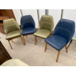 A SET OF FOUR MID CENTURY MODERN DESIGN DINING CHAIRS ON TEAK FRAMES WITH FAUX LEATHER COVERINGS