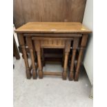 A NEST OF THREE OAK JACOBEAN STYLE TABLE