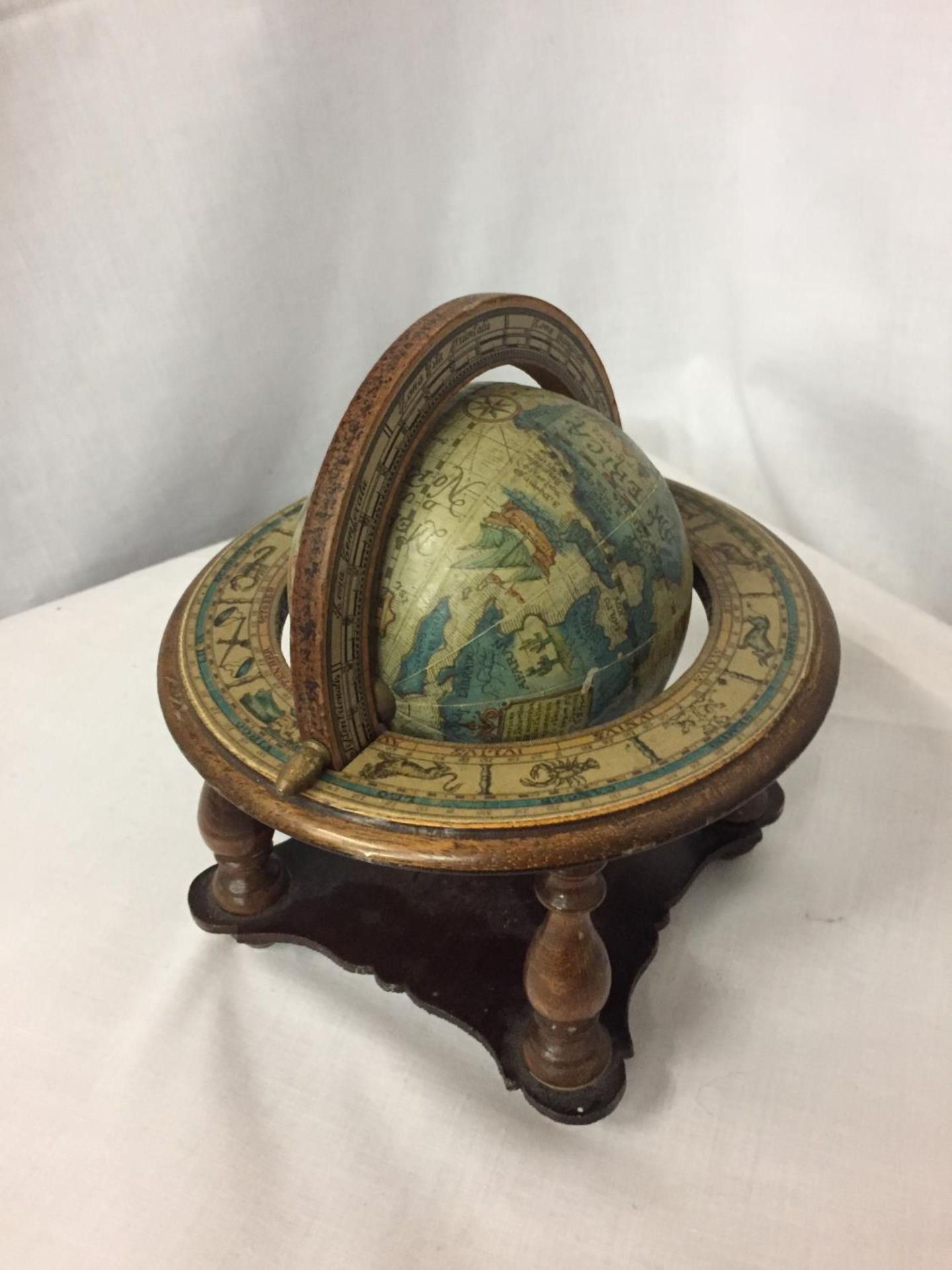 A SMALL WOODEN GLOBE ON A BASE HEIGHT APPROX 8 INCHES - Image 2 of 2