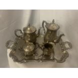 A VERY HEAVY AND ORNATE SILVER PLATED TEAPOT, COFFEE POT, SUGAR BOWL AND MILK JUG ON A TRAY