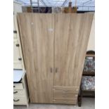 A MODERN TWO DOOR WARDROBE WITH THREE DRAWERS