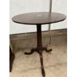 A GEORGE III MAHOGANY TRIPOD TABLE 22 INCHES DIAMETER ON A GUN BARREL STEM