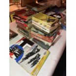 A LARGE AMOUNT OF PAPERBACK NOVELS ALL WAR RELATED PLUS WAR IN THE AIR MAGAZINES