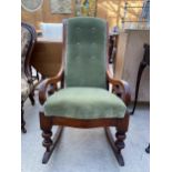 A VICTORIAN MAHOGANY ROCKING CHAIR