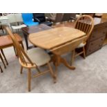 A MODERN DROP-LEAF PEDESTAL DINING TABLE AND TWO CHAIRS