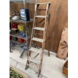 A VINTAGE FIVE RUNG WOODEN STEP LADDER