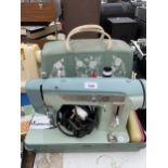 A RETRO CASED JONES SEWING MACHINE WITH FOOT PEDDLE