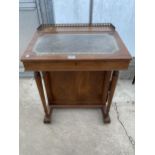 AN EDWARDIAN STYLE MAHOGANY DAVENPORT WITH BRASS GALLERY, TWO CANDLE SLIDES, FOUR DRAWERS AND FOUR