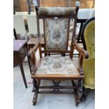A LATE VICTORIAN MAHOGANY ROCKING CHAIR WITH UNUSUAL SPRING ACTION