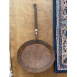 A VINTAGE CAST IRON FRYING PAN