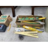 AN ASSORTMENT OF STEEL RULES AND TAPE MEASURES ETC