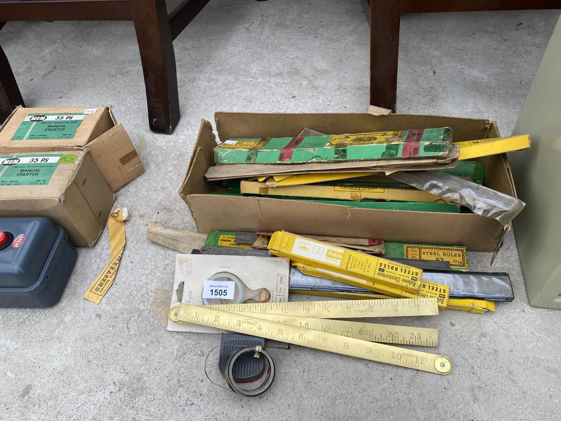 AN ASSORTMENT OF STEEL RULES AND TAPE MEASURES ETC