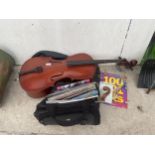 A LARGE ASSORTMENT OF MUSIC BOOKS AND A CELLO