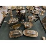 A LARGE QUANTITY OF SILVER PLATE TO INCLUDE TEA/COFFEE POTS, CANDLEABRAS, LIDDED DISHES ETC