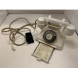 A VINTAGE IVORY BAKELITE TELEPHONE WITH NUMBER STORAGE DRAWER WIRED FOR MODERN USE BUT NO WARRANTY