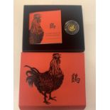 A THE ROYAL MINT 2017 LUNAR YEAR OF THE ROOSTER TENTH OUNCE £10 GOLD COIN WITH CERTIFICATE OF