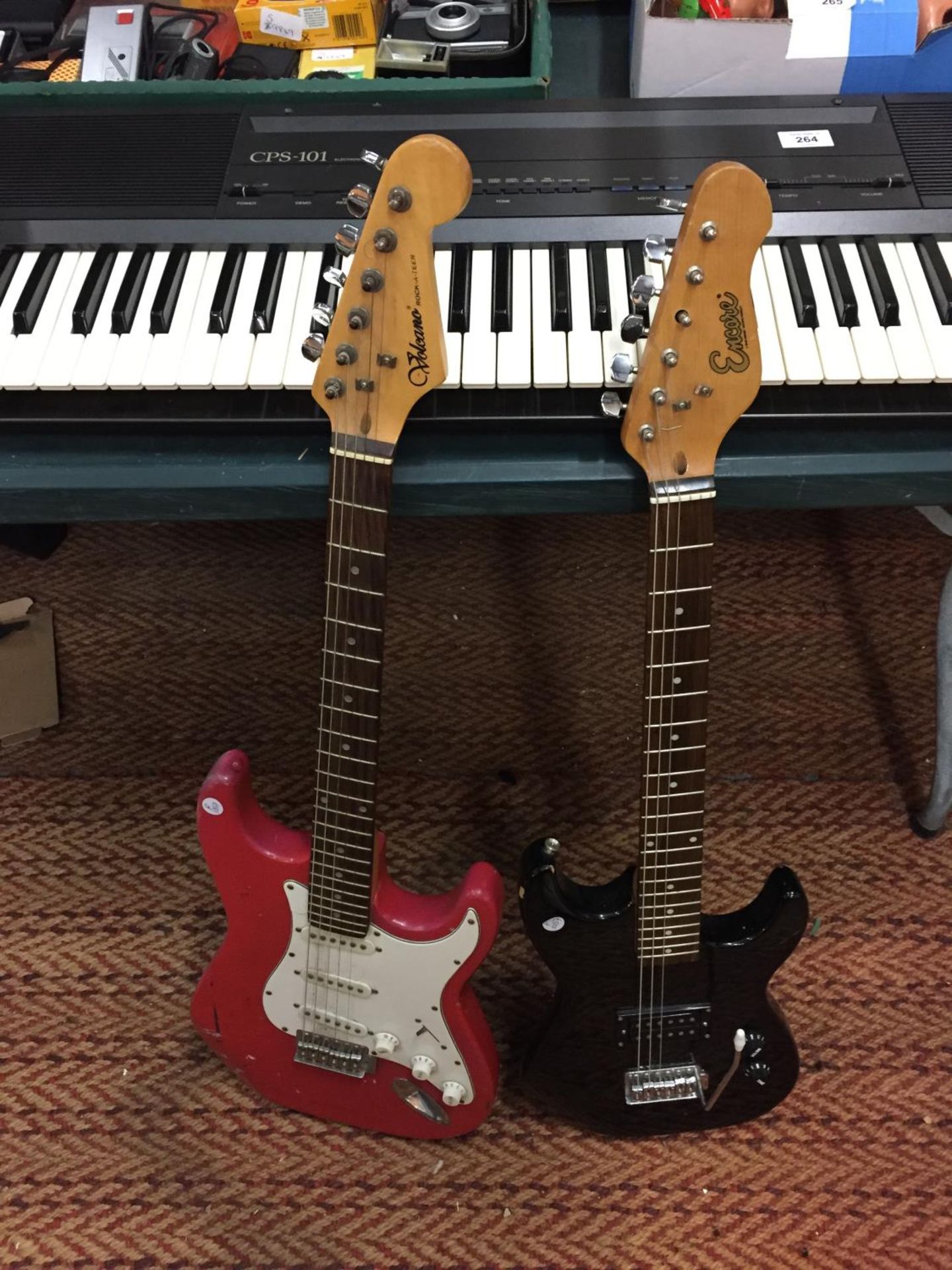 A RED VOLCANO ELECTRIC GUITAR, A BLACK ENCORE ELECTRIC GUITAR AND A CASIO KEYBOARD - Image 5 of 5