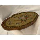 A VINTAGE OVAL WOODEN STAND WITH EMBROIDERY AND BEADWORK