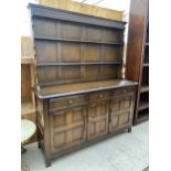 AN OAK OLD CHARM STYLE DRESSER WITH PLATE RACK