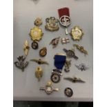 A BAG OF MILITARY BADGES