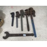 FIVE VARIOUS SIZED STILSONS AND A LARGE SPANNER