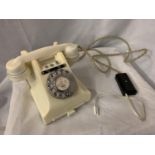 A VINTAGE IVORY BAKELITE TELEPHONE WITH BELL ON/OFF BUTTON AND PULL OUT NUMBER TRAY WIRED FOR MODERN