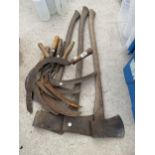 AN ASSORTMENT OF VINTAGE TOOLS TO INCLUDE SYTHES AND AXES ETC