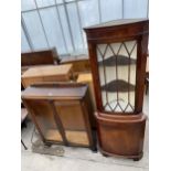 AN OAK DISPLAY CABINET WITH TWO GLAZED DOORS AND A MAHOGANY CORNER CABINET